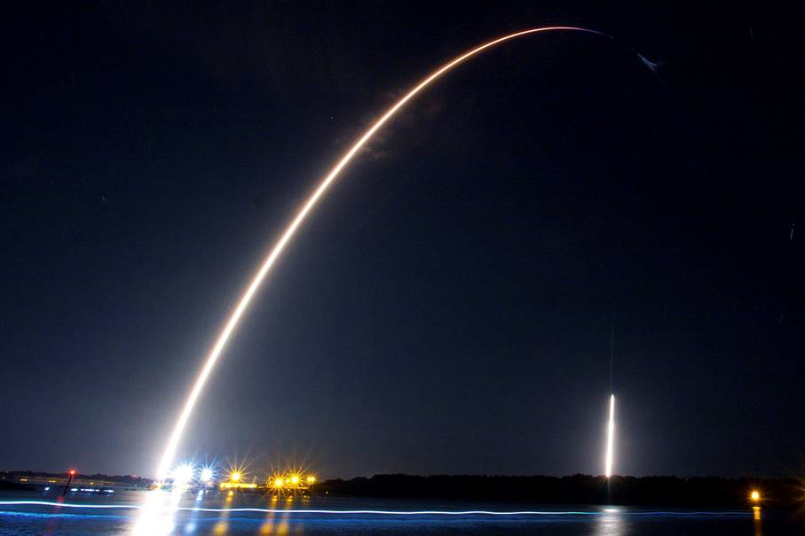 A rocket launch at night

Description automatically generated